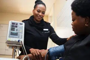 Woman getting her blood pressure checked.