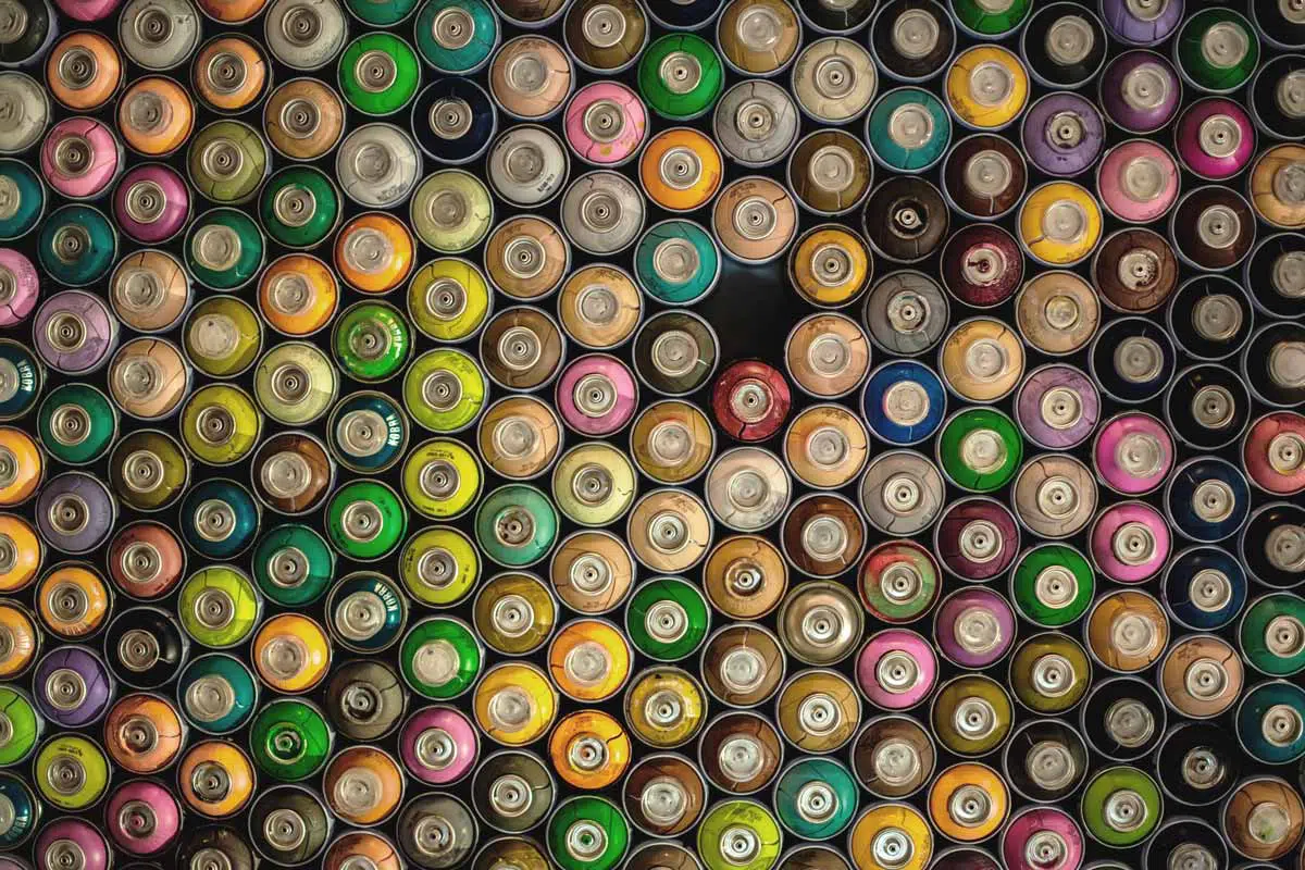 An assortment of spray paint cans.